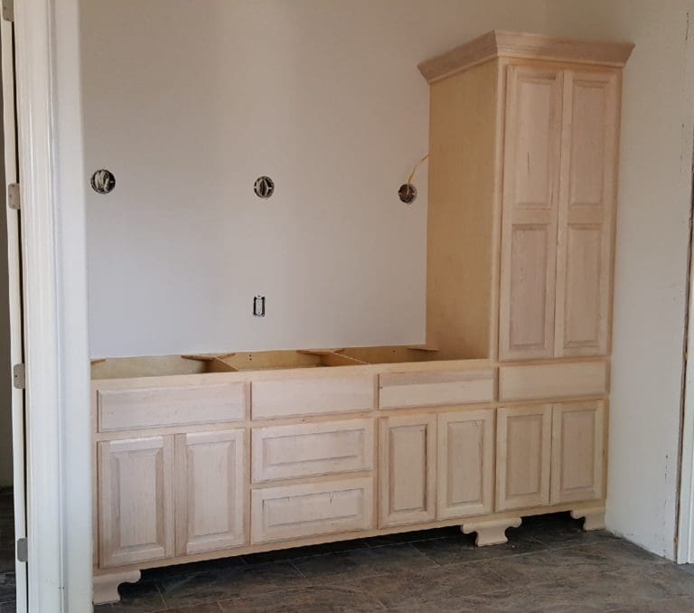 Bathroom vanity made with Cherry hardwood faces and doors.