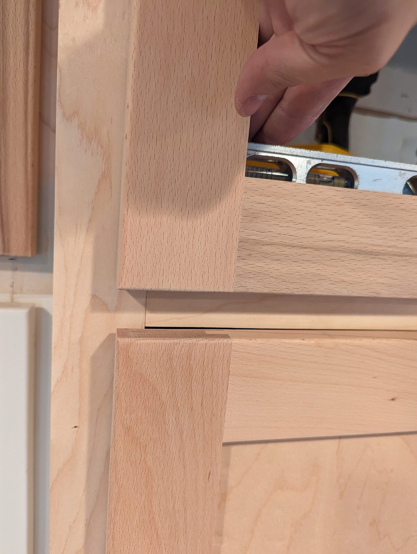 Aligning custom cabinet doors on a Houston Heights kitchen