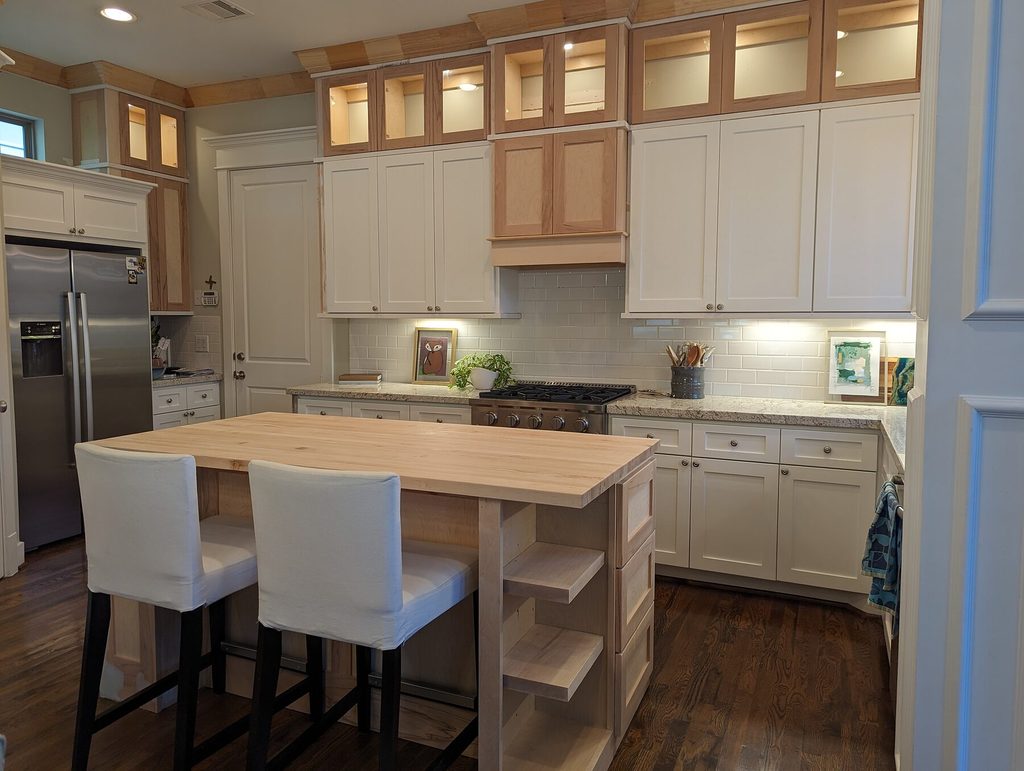 Custom kitchen island and glass-door cabinet toppers in Houston Heights