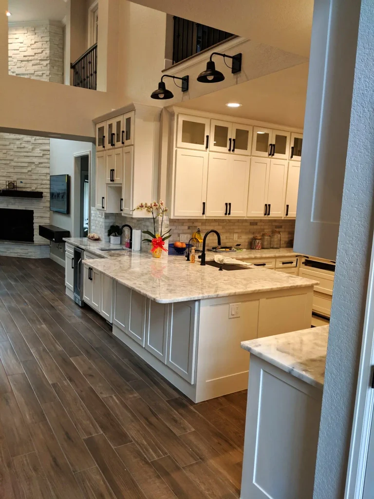 Finished Spring TX kitchen from the same doorway as the 3D drawing, island and painted cabinets