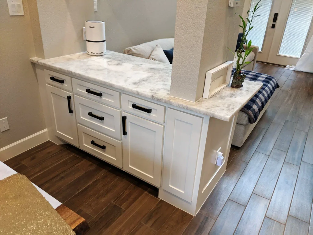 Custom paneled cabinet divider between the dining area and living room.