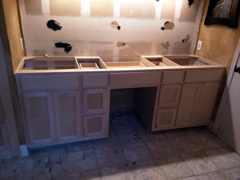 Custom double bathroom vanity with makeup knee space and drawer stacks, installed unpainted before tops, Spring TX
