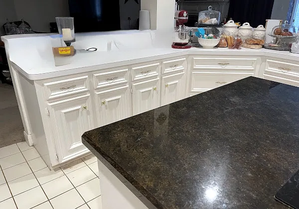 Before: old peninsula with granite top in a Memorial Northwest kitchen, Spring/Klein