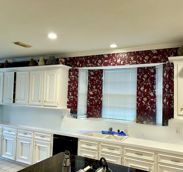 Before: dated white kitchen cabinets and wallpaper in a Memorial Northwest home, Spring/Klein