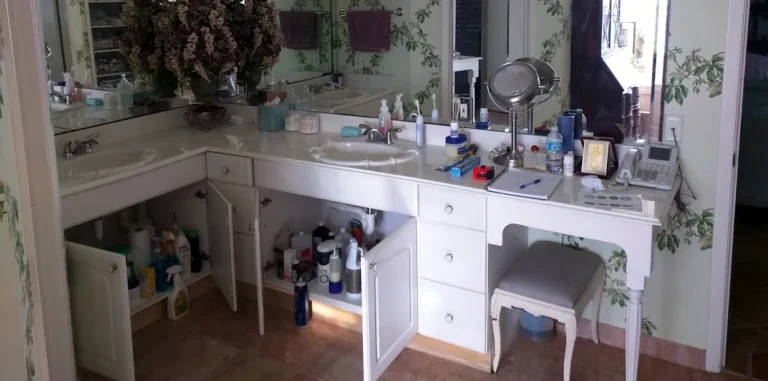 Before: original L-shaped master bath vanity in a Champions South, Spring TX home, before the custom rebuild